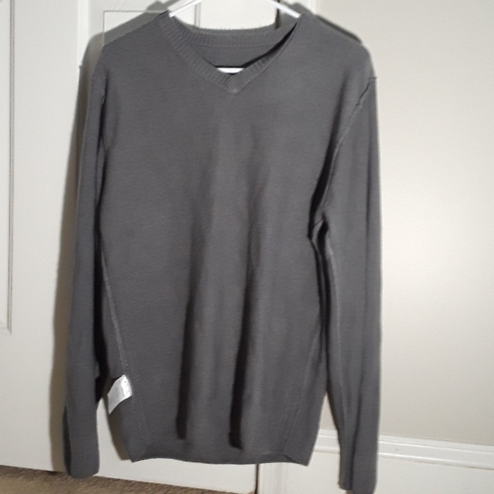 a grey sweater